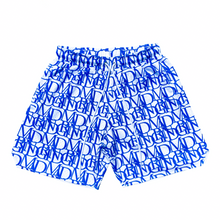 Load image into Gallery viewer, Front view of our D&#39;PAT Hoops Shorts featuring the MADGRIND brand name as it&#39;s main design.