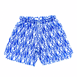 Front view of our D'PAT Hoops Shorts featuring the MADGRIND brand name as it's main design.