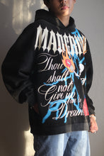 Load image into Gallery viewer, A model representing the Commandment V2 Hoodie. (slight side view)