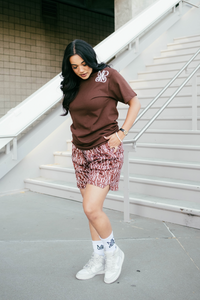 Our model wearing and representing our Monogram Logo Tee Brown combined with our Monogram Pattern Shorts (Brown) including the MADGRIND iconic socks.